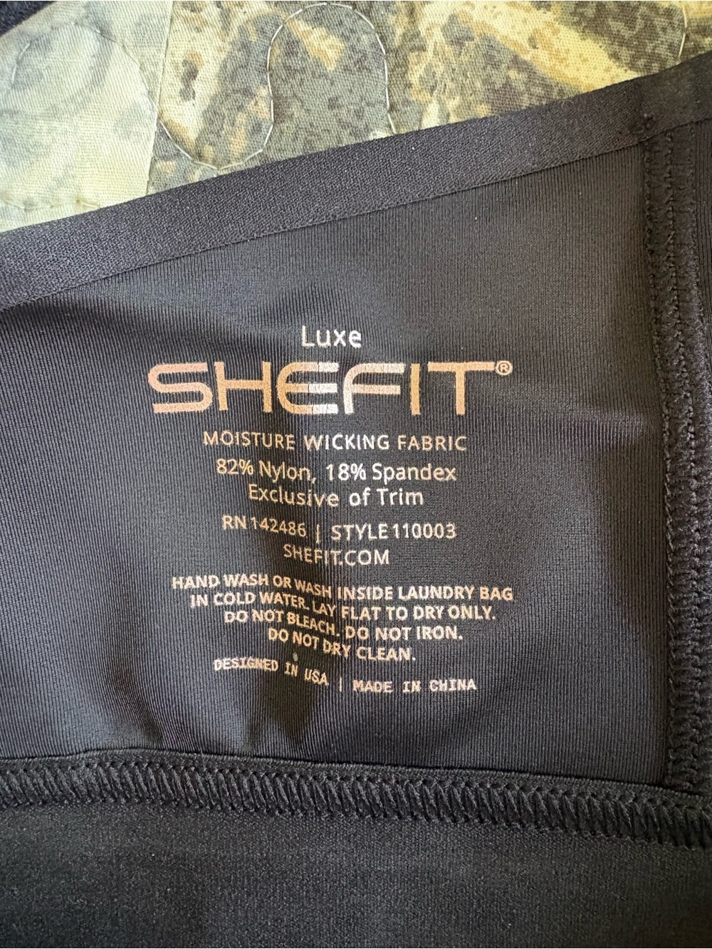 SHEFIT one Luxe Black and one Luxe Rose color with Subtle Gold Logo.